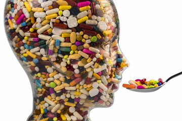 Kopf aus Glas mit Tabletten