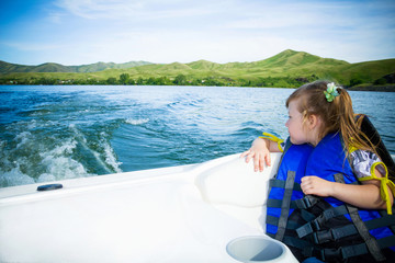 Travel of children on water in the boat