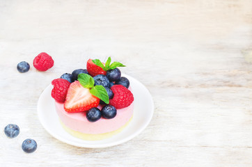 souffle cake with fresh raspberries, blueberries and strawberrie