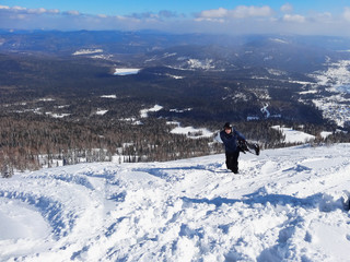 Man with snowboard  in Sheregesh
