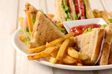 French fries and club sandwich
