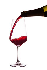 Pouring red wine. Isolated on white.with path