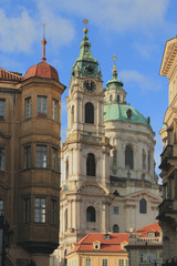 Fototapeta na wymiar City and temple. Cathedral St. Mikulasha, Prague, Czech Republic