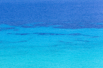 Blue sea surface with waves background.