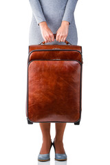 Woman holds suitcase