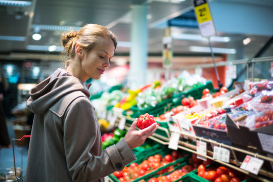 Pretty, young woman shopping for fruits and vegetables