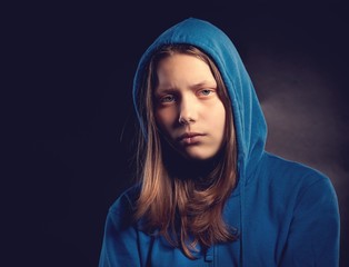 Afraid teen girl in hood