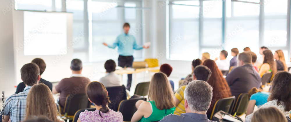Poster speaker at business convention and presentation.