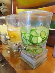 Fruit and vegetable infused ice water in a lobby.