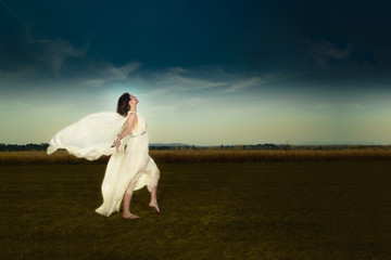 Young dark hair woman in field