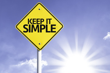 Keep it Simple road sign with sun background