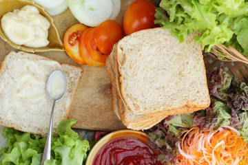 making tuna sandwich with fresh vegetables