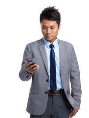 Naklejka premium Businessman read on cellphone