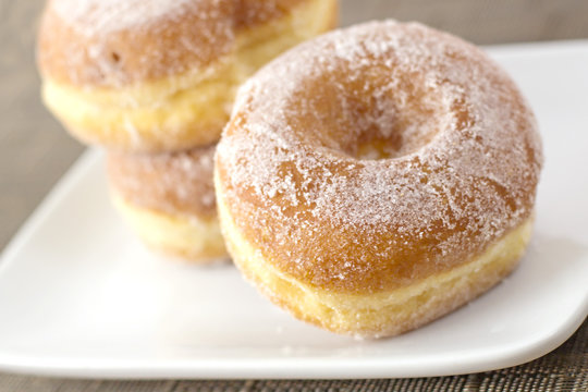 Sugar Covered Donuts on White Plate