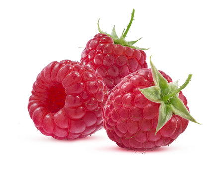 Group of three raspberries isolated on white background