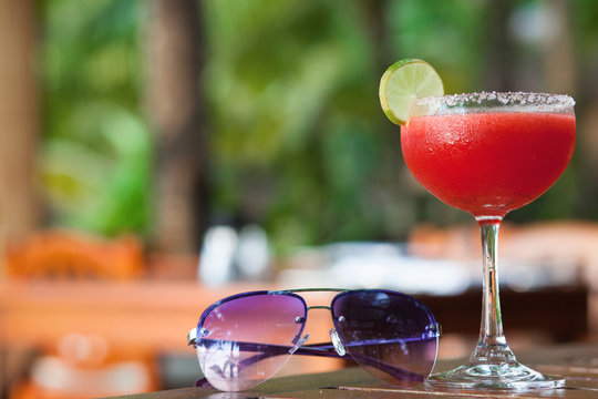 margarita cocktail with sunglasses in luxury tropical lounge