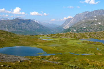 Naklejka na ściany i meble little pond and rocks in the Norwegian mountains