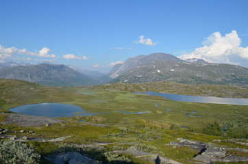 Naklejka na ściany i meble little pond and rocks in the Norwegian mountains