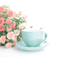 Fototapeta na wymiar Coffee cup and roses.
