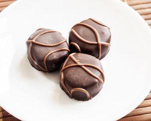 Tasty chocolate bonbon isolated on a white background