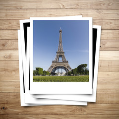 Eiffel Tower memory on photo frame brown wood plank background