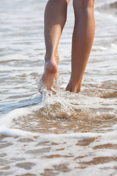 woman walking on the sand beach