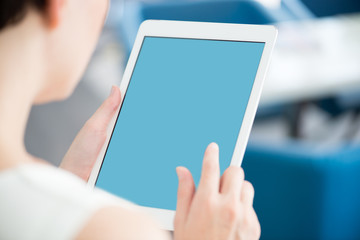 Woman with modern white digital tablet - obrazy, fototapety, plakaty