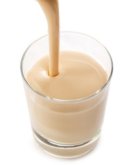 Pouring yogurt into glass