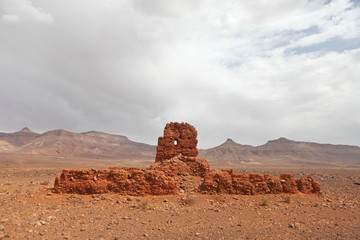 Ruins of clay building near Atlas mountains, Morocco
