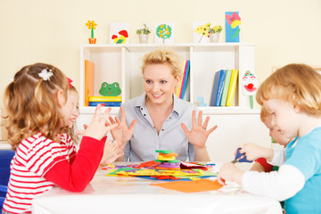 Teacher talking with children.