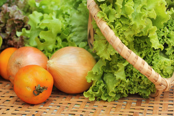 Vegetables salad and tomato in the basket