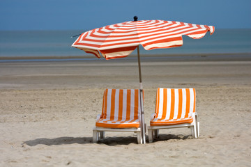 Beach chairs and umbrella, Belgium.
