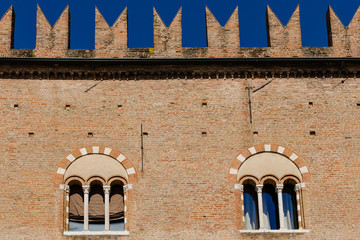 windows of an old palace in Italy