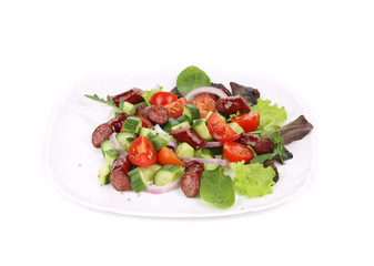 Fresh salad with sausage.