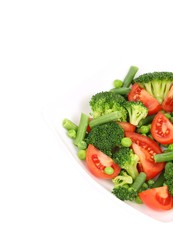 Broccoli salad with tomatoes and green peas.
