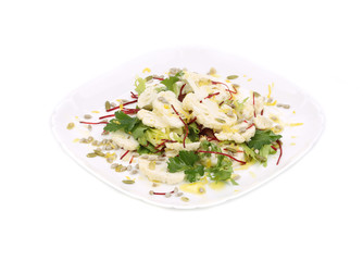 Cauliflower salad with seeds and parsley.