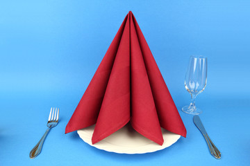 Folded napkin on the white plate