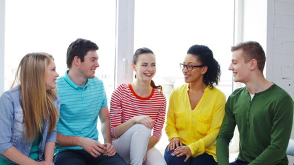smiling students making high five gesture