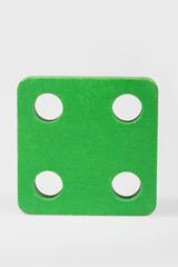 Wooden baby block on a white background