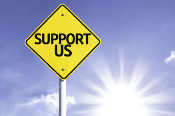 Support Us road sign with sun background