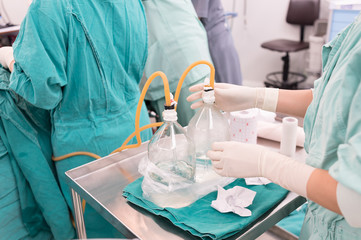 scrub nurse praparing chest drains post operative