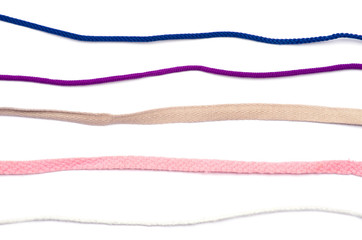 collection of various ropes on white background. each one is sho