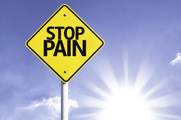 Stop Pain road sign with sun background