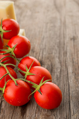 Cherry tomatoes cheese wooden table