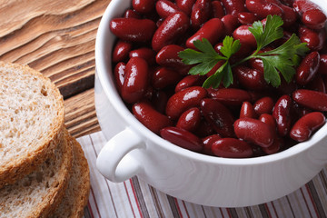 red kidney beans in a bowl and ​​bread horizontal top view