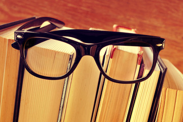 books and eyeglasses, with a retro effect