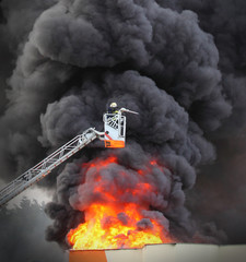 Firefighter and burning house.