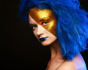 Portrait of young woman in superhero cosmetics