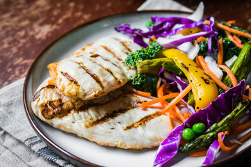 Grilled chicken breasts with vegetables