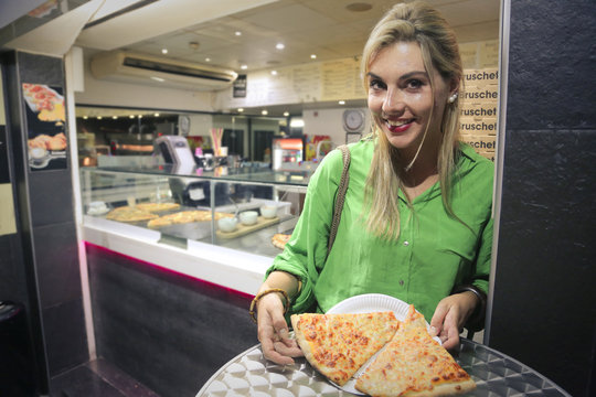 woman with a takeaway pizza
